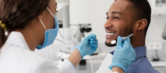 Seymour Dental Associates PLLC man being examined for extractions